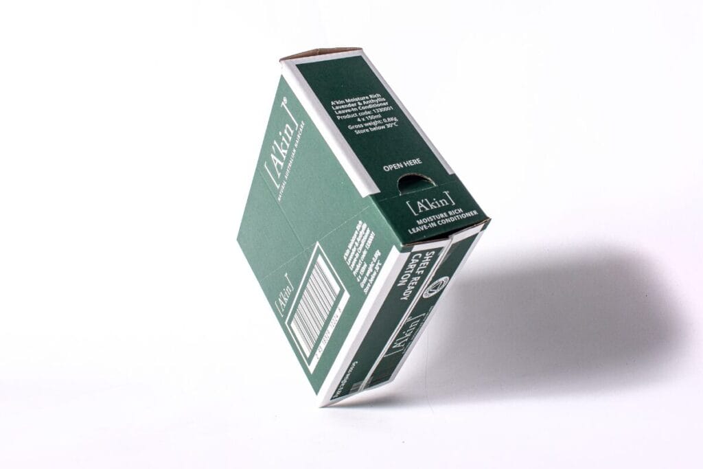 a green cardboard box printed with business branding
